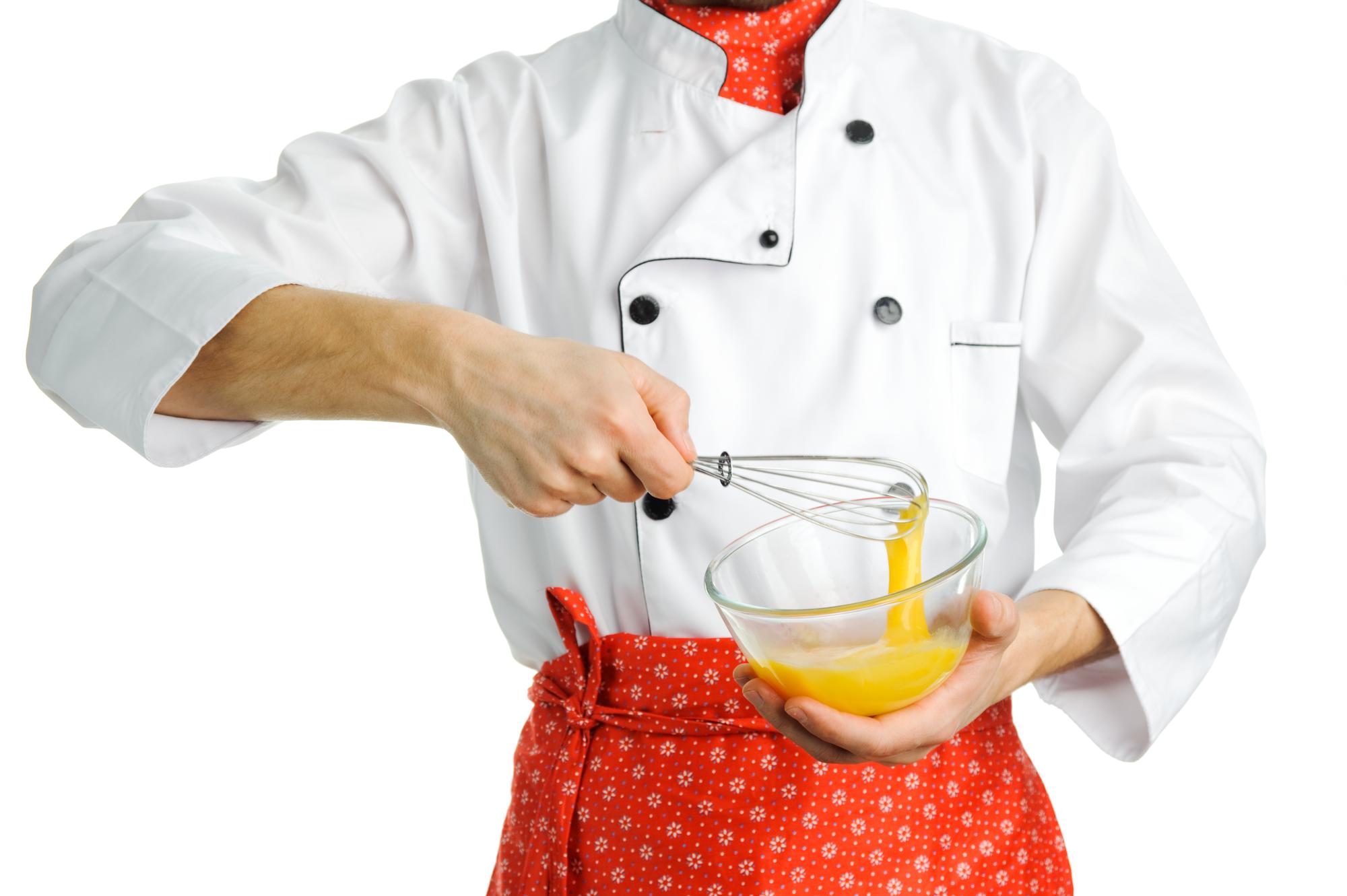 Student stirring sauce in home kitchen